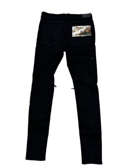 Amiri Patchwork Distressed
Skinny Jeans